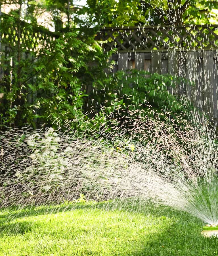 A lawn getting watered | Wright Environmental